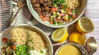 Israeli inspired salad, paired with quinoa, feta, lamb mince, fresh parsley and lemon tahini dressing